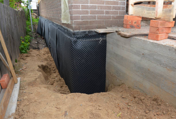 SJ Waterproofing Pros technician performing targeted Emergency Waterproofing assessment in Chelsea, MI